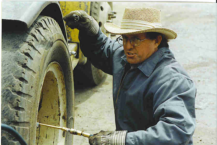 Bill, airing up a tire on his forklift