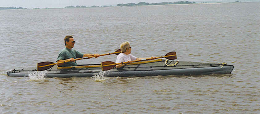 Two people paddling a Klepper double kayak in open coastal water off Jekyll Island, Georgia