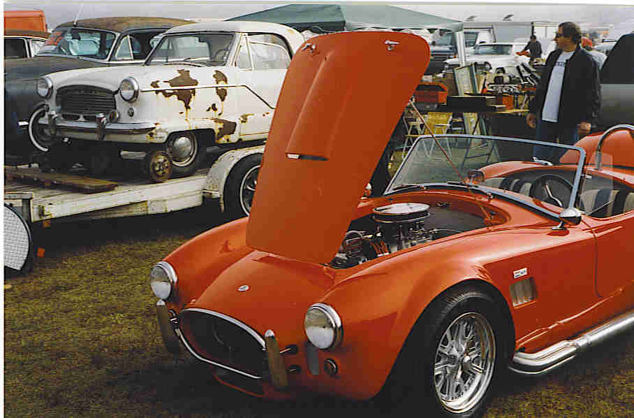 A Ford Cobra keeps company with a Metropolitan
