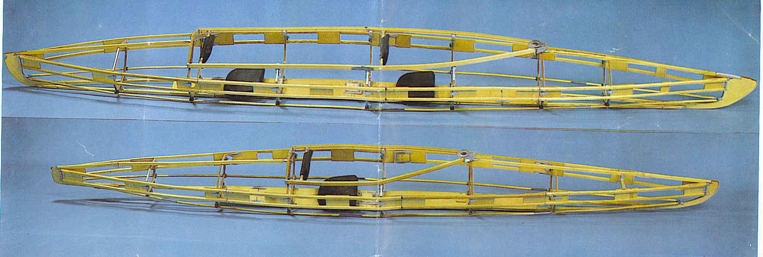 Overhead view of the assembled wooden frames of a Klepper double and single kayak laid side by side